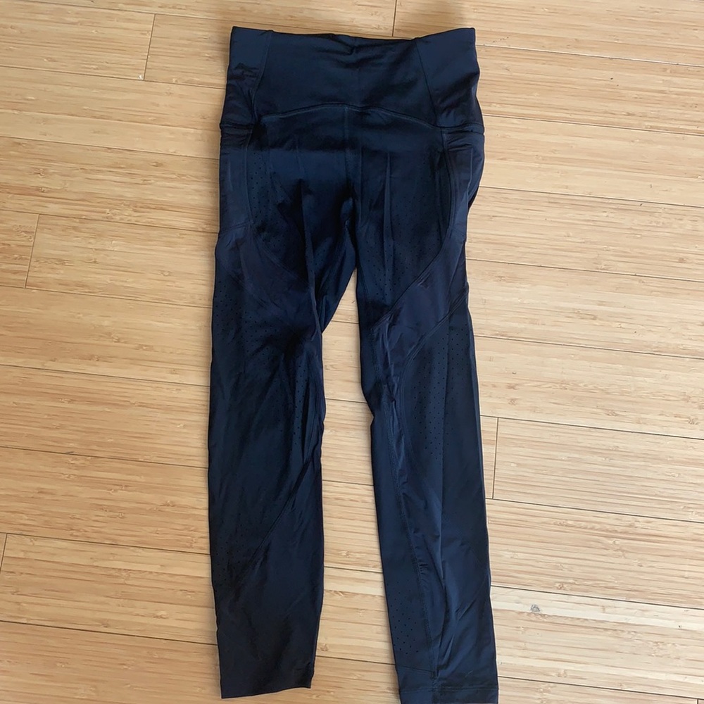Lululemon black leggings - high waisted - pockets - mesh detailing